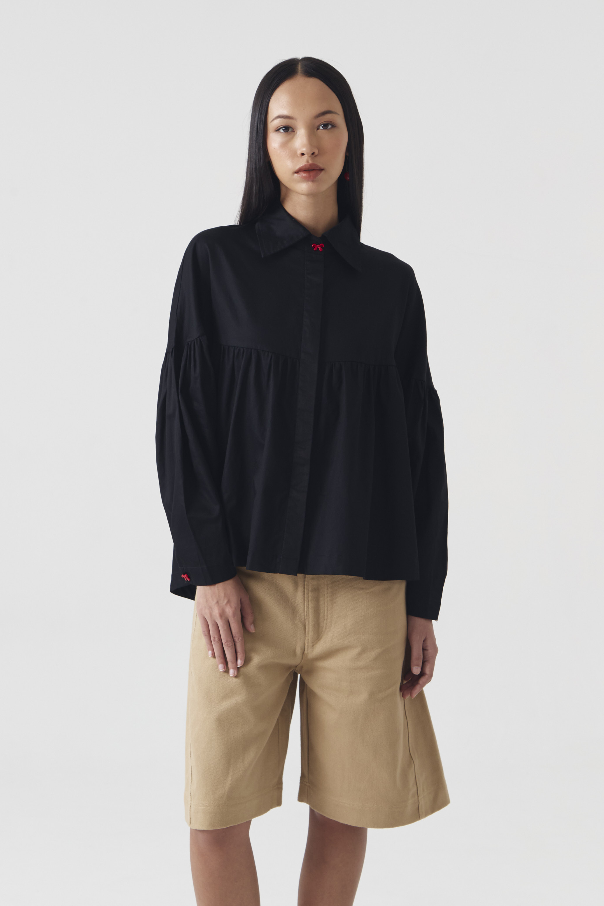 CHÉRI SURGE Black Ruffle Blouse