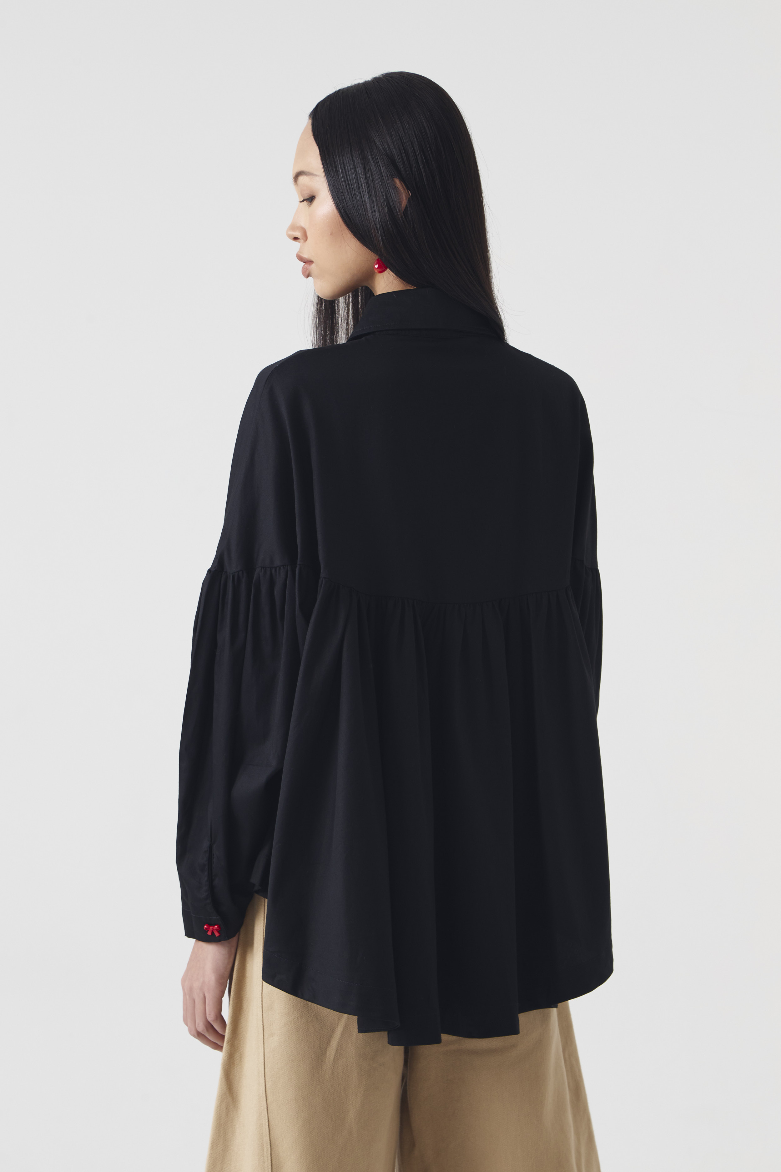 CHÉRI SURGE Black Ruffle Blouse